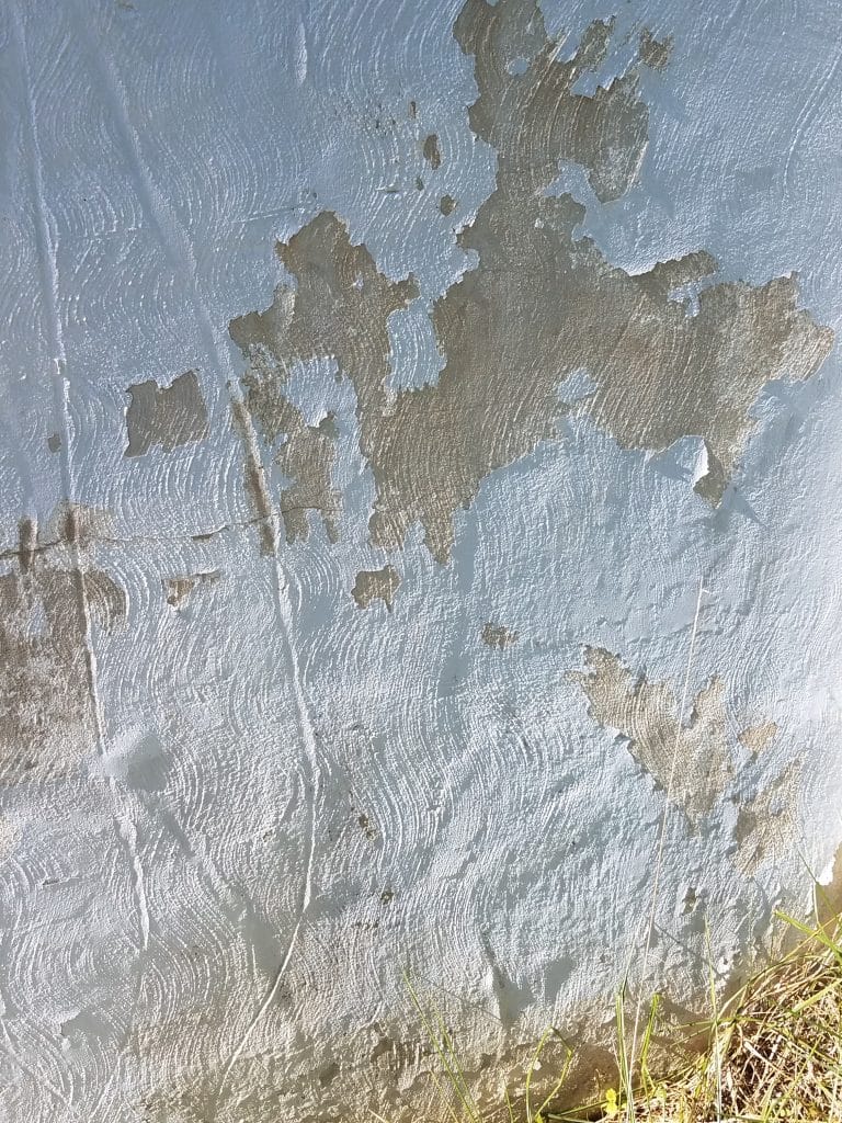 Paint peeling off a foundation