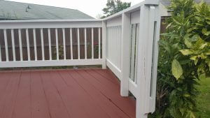 solid stain vs. paint? how about both this picture shows solid stain on the deck boards but paint on the handrail