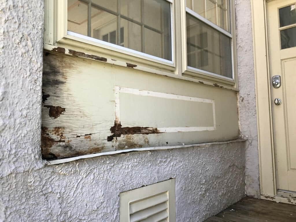 essential home repairs include replacing rotten wood with PVC