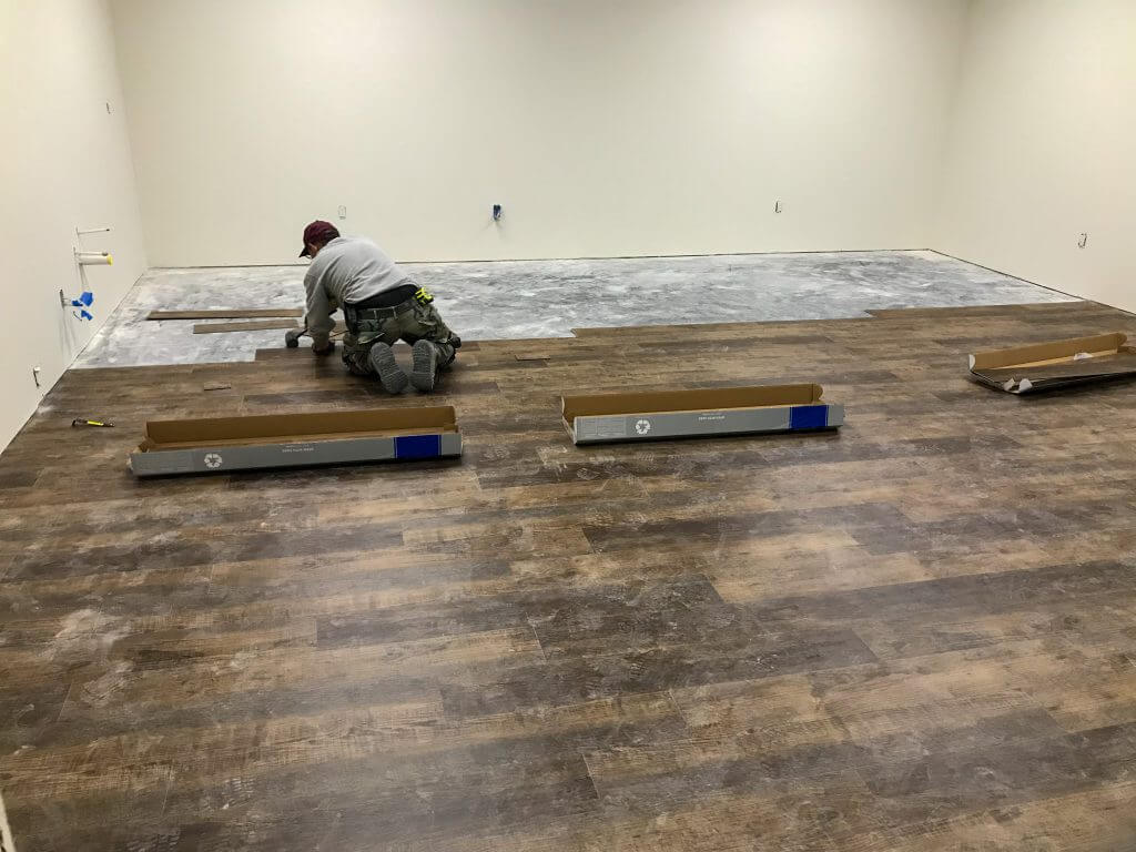 Laminate flooring Installation with man installing