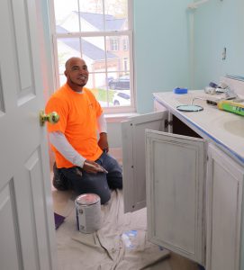 Klappenberger & Son Employee painting kitchen cabinets