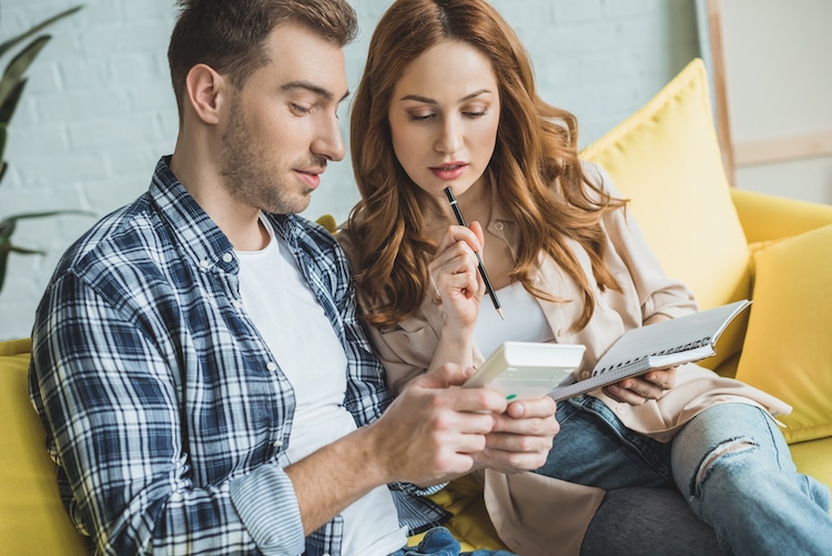 Couple Using A Painting Calculator