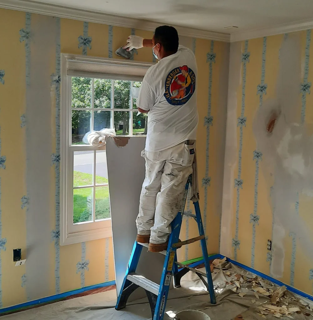 Painter removing wallpaper