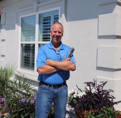 David Klappenberger standing in front of Stucco Home