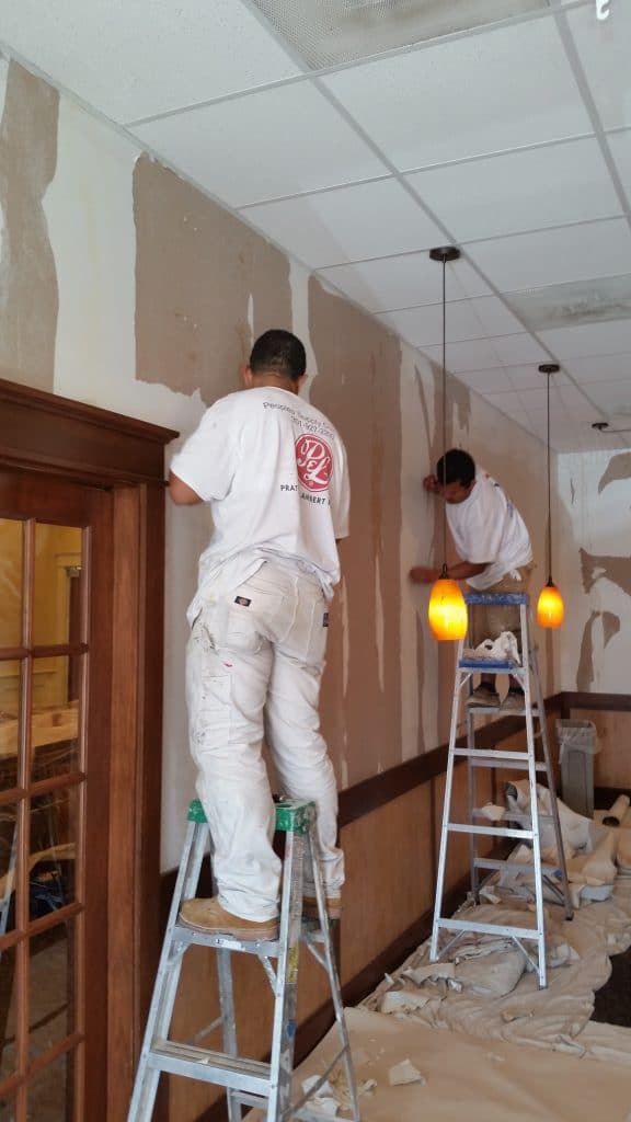 painters removing wallpaper