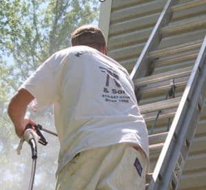 Severna Park painting contractor power washing side of house Klappenberger & Son employee