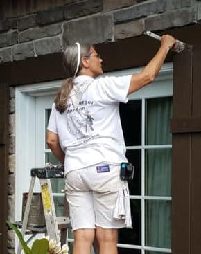 Painters Severna Park lady painting shutter for Klappenberger & Son