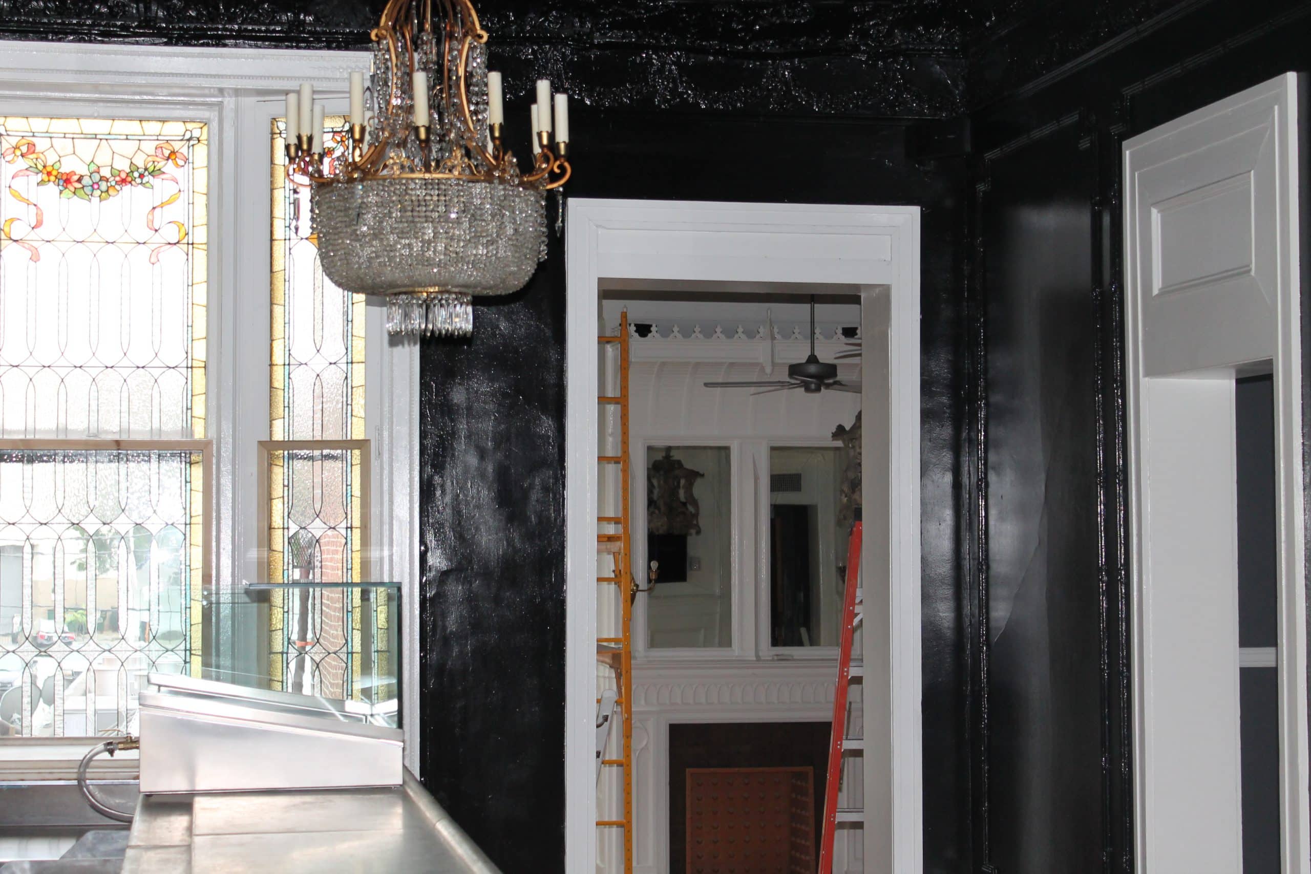 A Painting contractor in Nashville who painted high gloss black paint on walls in this bar.