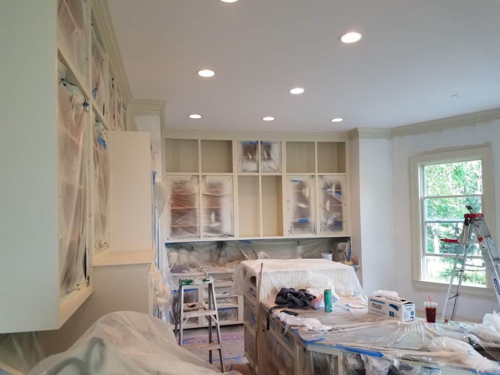 in the process of painting kitchen cabinets in Fairfax