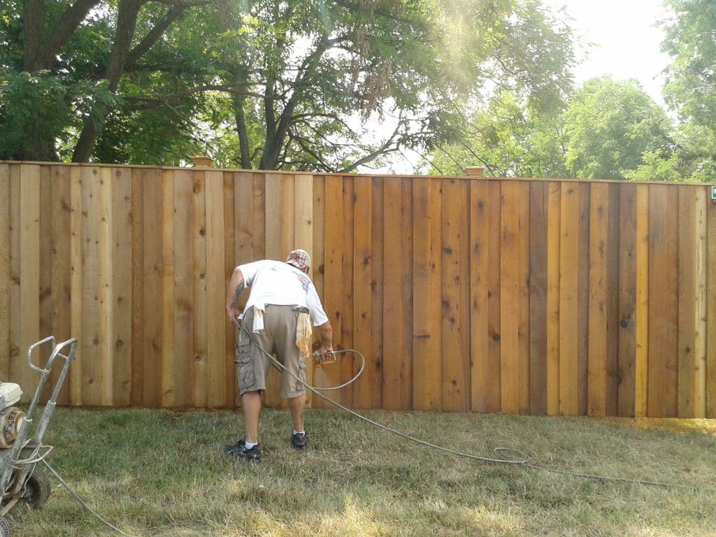 fence staining with a sprayer