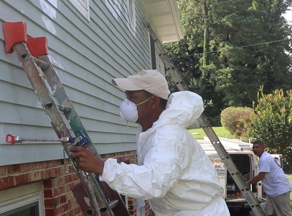 Spraying the exterior of a home in Frederick