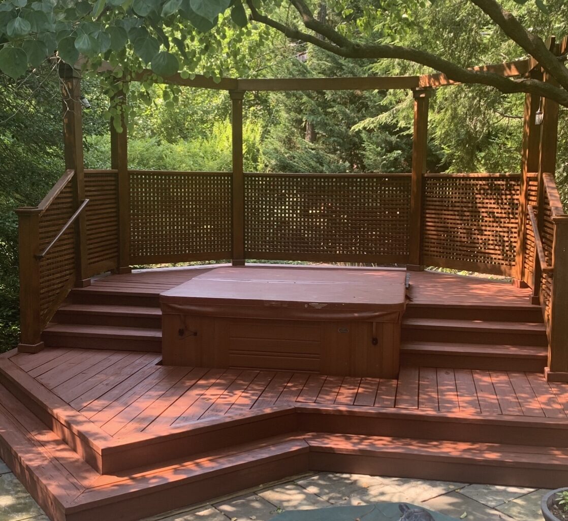 Painting company in Atlanta finished sealing deck with hot tube.
