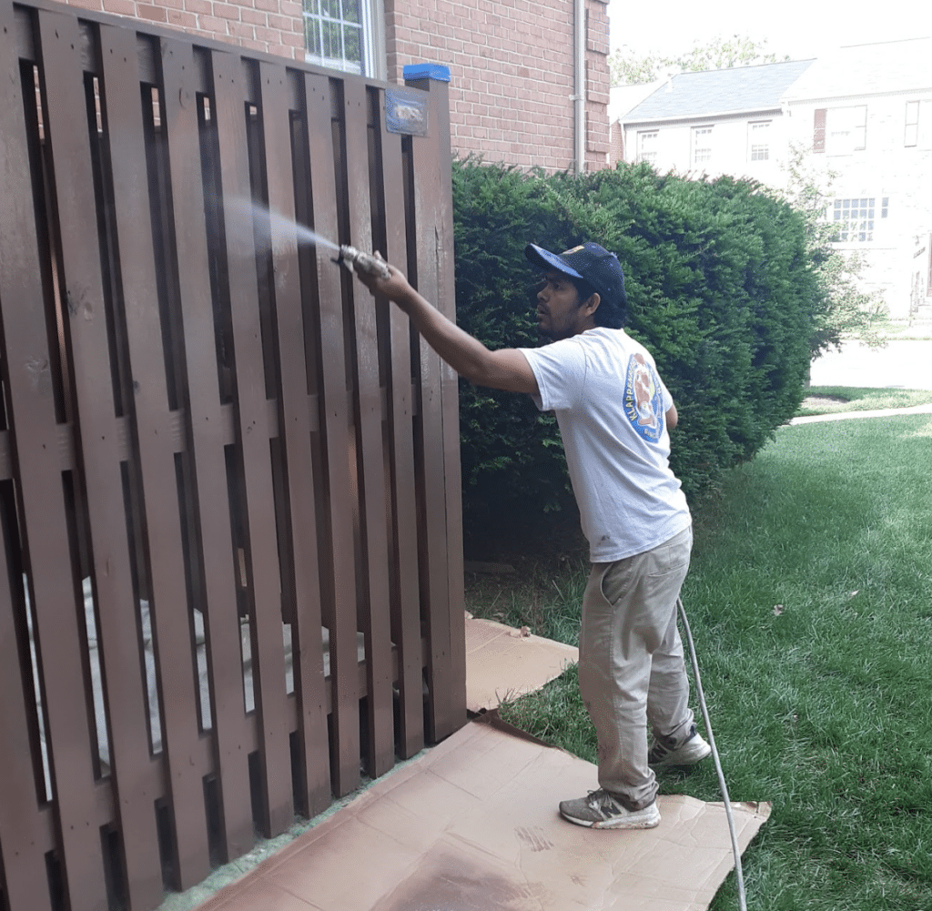exterior painting in Crofton includes staining a shadow box fence