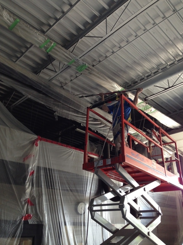 Commercial painting contractor Klappenberger & Son spraying Dryfall