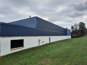 Howard County painters painting this very long commercial building by Klappenberger & Son