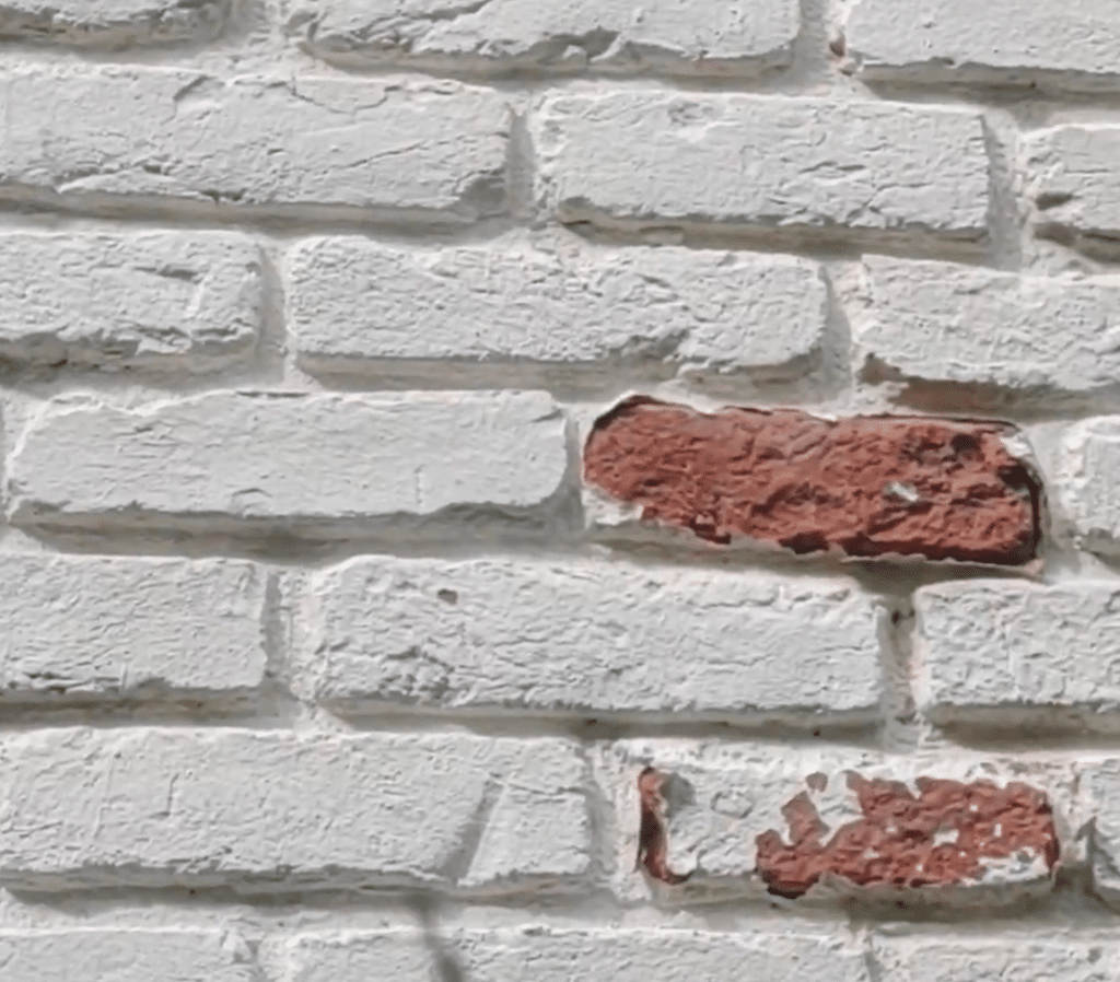This brick has many layers of paint applied and is peeling. Limewash allows the brick to breath and never peels.