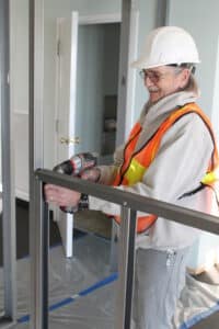 Nashville Commercial Painting Contractor framing a wall in an office.