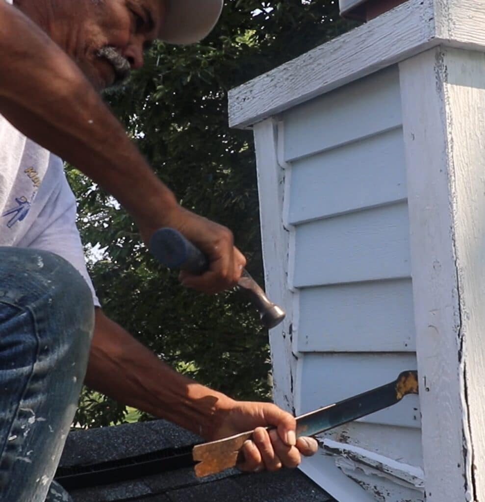 man replacing rotten wood with Klappenberger & Son