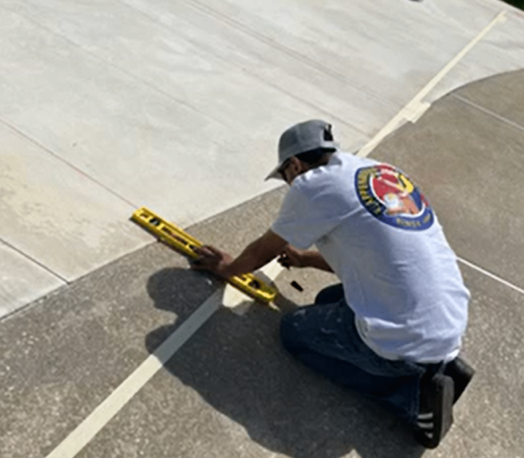 painter marking lines for picklecourt painting job by Klappenberger & Son