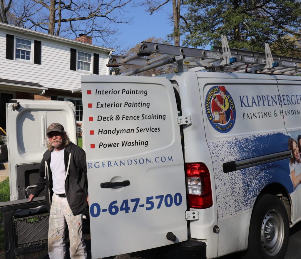 klappenberger & Son man standing by a klappenberger & Son truck