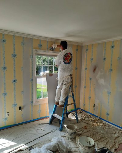 Spackle and paint over wallpaper