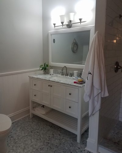 Castleberry After (3) Bathroom renovations with new floor and painted vanity