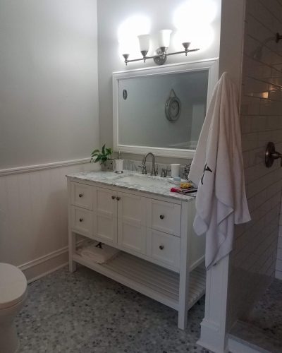 Bathroom renovations with new floor and painted vanity