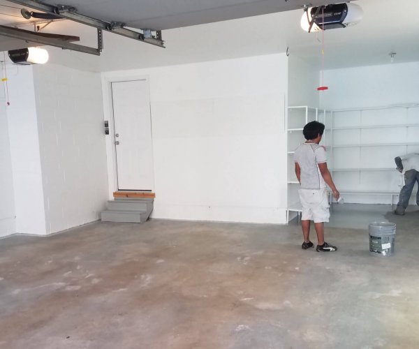 PT first coat (3) epoxy garage floor contractor Klappenberger & Son applying Rust Oleum on garage concrete.