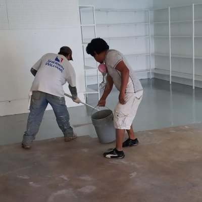 edited two guys applying epoxy paint on garage for Klappenberger & Son