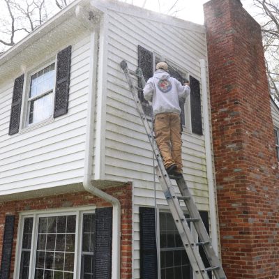 exterior painting in Crofton starts with power washing this vinyl siding home.