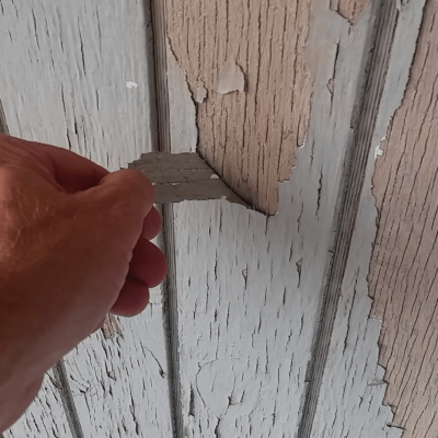 example of paint peeling off wood.
