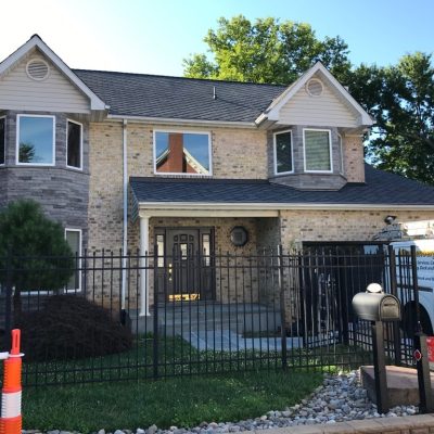 Exterior Painters In Richmond getting ready to paint brick house