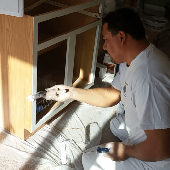 Klappenberger & Son painter Roberto, painting kitchen cabinets in Westminster MD.